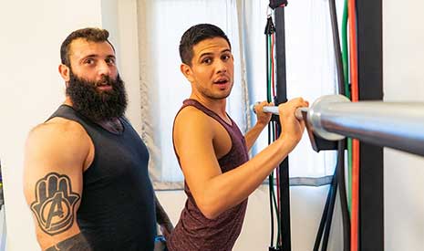 Mischievous trainer, Markus Kage, is at it again! When a new client, Alex Montenegro, and he meet for their first session, the hairy, muscled tattooed trainer is told that he wants to work on his butt.