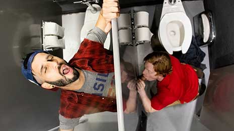 Romeo Davis is cruising at the urinals of the public restroom when Kyle Connors slips off his wedding band and notices Romeo's throbbing uncut member.
