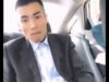 A suited asian Guy Jerking Off alone in the car